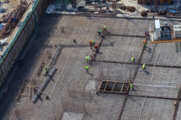 Workers working at a building construction site.